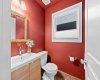 A bold, colourful powder room adds character and convenience on the main floor.