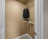 A walk-in closet provides generous hanging and shelf space to keep everything organized.