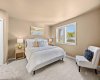 A soft and warm palette make the primary bedroom feel like a true retreat.