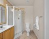 A separate walk-in shower keeps things practical alongside the soaker tub and double vanity.