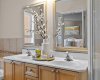 A closer look at the primary ensuite's double vanity shows a bright, well-appointed space to get ready for the day.