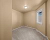 This upper-level bedroom brings in plenty of natural light through its window.