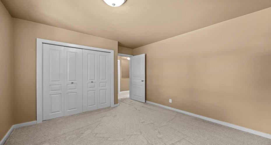 A third upper-level bedroom includes a closet and flows easily into the hallway.