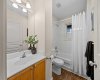 A well-appointed upper-level bathroom serves the additional bedrooms with a walk-in shower and tub combo.