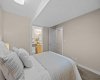 A lower-level bedroom connects directly to a private ensuite, adding convenience for guests or family.