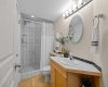 A convenient 3-piece bathroom serves the lower level with a walk-in tiled shower.