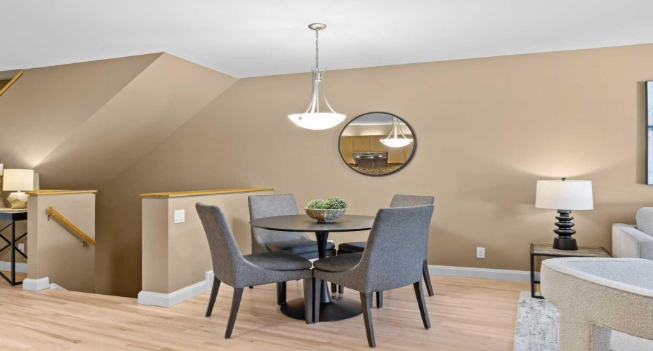 A cozy dining nook sits just off the kitchen, perfect for everyday meals or entertaining.