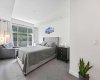 Admire the spacious primary bedroom facing those natural views.
