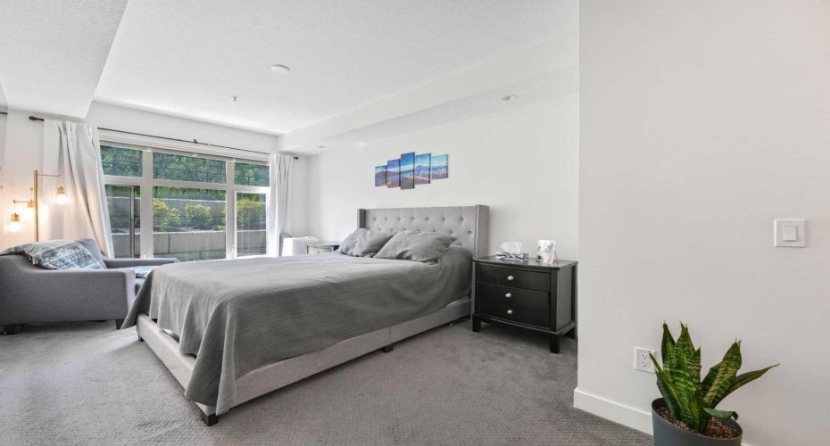 Admire the spacious primary bedroom facing those natural views.