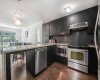 Notice the ceiling height cabinets, ample counter space, and extra stool area.