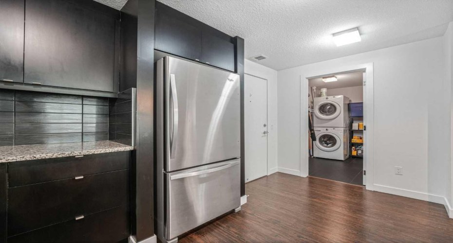 Spacious laundry and storage space neatly tucked away.