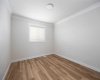 Crown moulding with vinyl plank floors in bedrooms