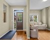 Spacious front entrance with living room to the left