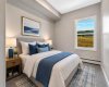 This is a staged image from a previous building showing the  bedroom in suite 201