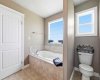 Primary bedroom soaker bath tub