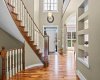 A dramatic curved staircase and rich hardwood floors greet you in the sun filled two storey foyer. A dramatic curved staircase and rich hardwood floors greet you in the sun filled two storey foyer.
