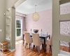 An elegant formal dining room sets a sophisticated tone, with statement wallpaper and a striking globe chandelier. An elegant formal dining room sets a sophisticated tone, with statement wallpaper and a striking globe chandelier.