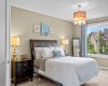 Soft tones and thoughtful lighting create a calm, restful atmosphere in the generously sized primary bedroom. Soft tones and thoughtful lighting create a calm, restful atmosphere in the generously sized primary bedroom.