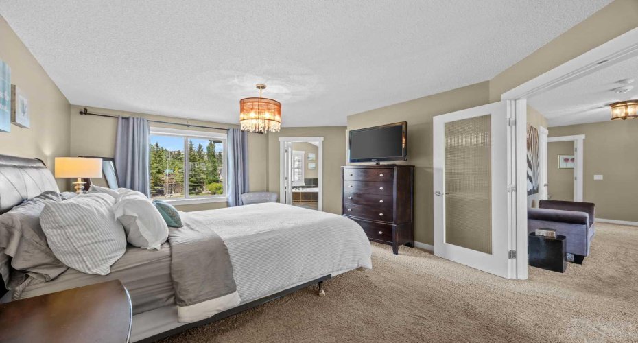 This expansive primary suite includes a private sitting area and direct access to the spa like ensuite, offering a true owner's retreat. This expansive primary suite includes a private sitting area and direct access to the spa like ensuite, offering a true owner's retreat.
