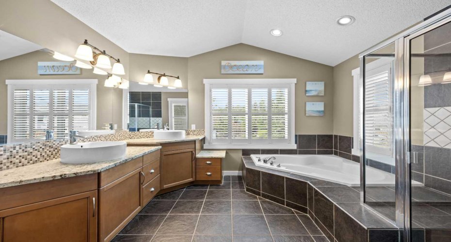 This expansive primary suite includes a private sitting area and direct access to the spa like ensuite, offering a true owner's retreat. This expansive primary suite includes a private sitting area and direct access to the spa like ensuite, offering a true owner's retreat.