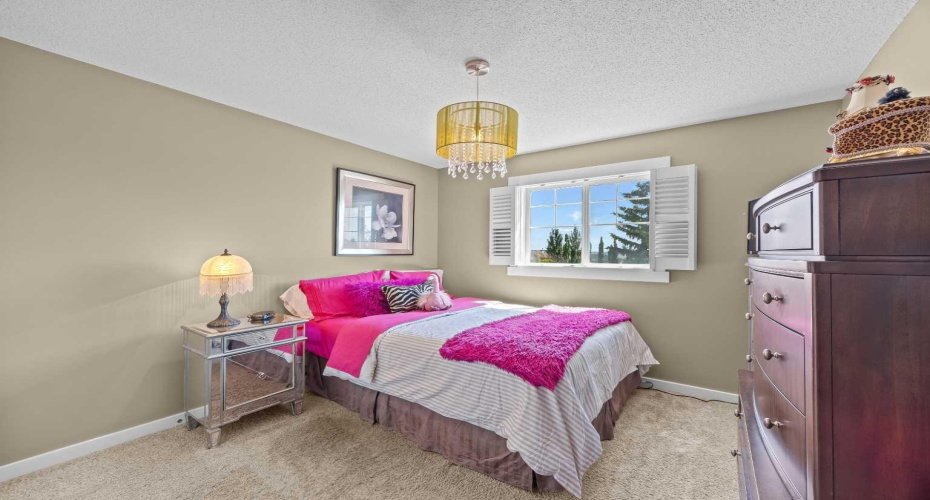 A playful secondary bedroom offers plenty of natural light and space to make it your own. A playful secondary bedroom offers plenty of natural light and space to make it your own.