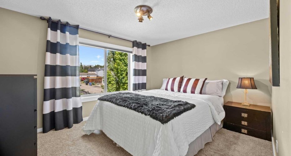 A bright and versatile 3rd upper level bedroom offers tons of natural light and treetop views. A bright and versatile 3rd upper level bedroom offers tons of natural light and treetop views.