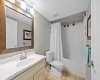 A well appointed full bathroom serves the upper level bedrooms with a tub and shower combination. A well appointed full bathroom serves the upper level bedrooms with a tub and shower combination.