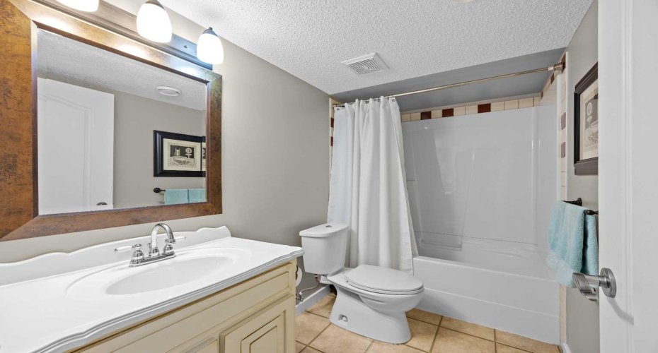 A well appointed full bathroom serves the upper level bedrooms with a tub and shower combination. A well appointed full bathroom serves the upper level bedrooms with a tub and shower combination.