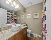 The lower level bathroom is bright and fun, finished with a stylish vanity and playful decor touches throughout. The lower level bathroom is bright and fun, finished with a stylish vanity and playful decor touches throughout.