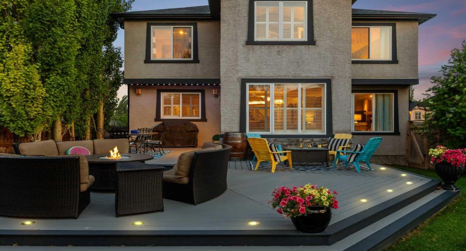 The deck comes alive at dusk, offering multiple seating areas perfect for entertaining under the evening sky. The deck comes alive at dusk, offering multiple seating areas perfect for entertaining under the evening sky.