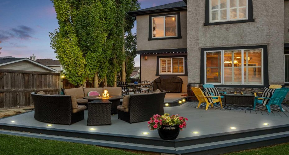 Another look at the beautifully lit deck at twilight, where the outdoor living space truly shines. Another look at the beautifully lit deck at twilight, where the outdoor living space truly shines.