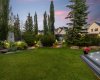 Mature landscaping, a garden shed and thoughtfully placed lighting create a private, park like setting in the backyard. Mature landscaping, a garden shed and thoughtfully placed lighting create a private, park like setting in the backyard.