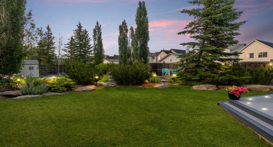 Mature landscaping, a garden shed and thoughtfully placed lighting create a private, park like setting in the backyard. Mature landscaping, a garden shed and thoughtfully placed lighting create a private, park like setting in the backyard.