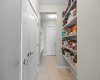 A generous walk through pantry and adjoining mudroom provide exceptional storage just off the kitchen. A generous walk through pantry and adjoining mudroom provide exceptional storage just off the kitchen.