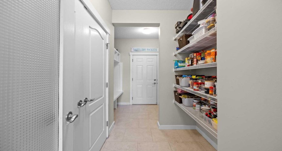 A generous walk through pantry and adjoining mudroom provide exceptional storage just off the kitchen. A generous walk through pantry and adjoining mudroom provide exceptional storage just off the kitchen.