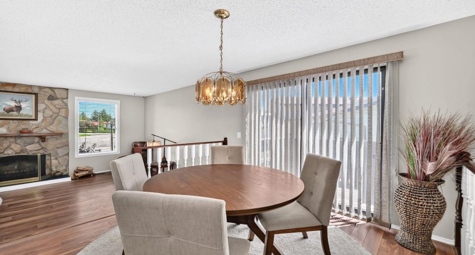Spacious dining room with patio doors too wrap