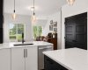 Matte black interior doors, upgraded MDF cabinetry and a timeless colour palette
