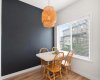 Spacious Dining Room with Accent Wall and South-Facing Window