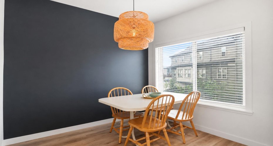 Spacious Dining Room with Accent Wall and South-Facing Window
