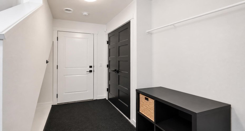 Adjoining Mudroom with Stacked Washer/Dryer