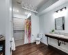 The ensuite with role in shower and another lift bar