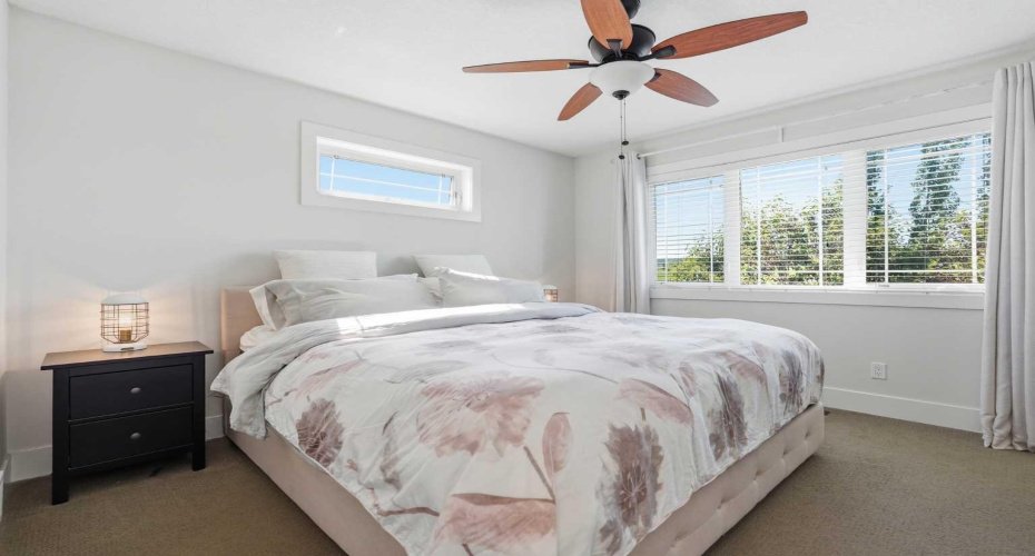 Expansive primary bedroom featuring an upgraded upper window that opens!
