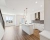View to Kitchen, Dining Area & Living Room • PLEASE NOTE: Kitchen appliances are included, and will be installed prior to possession.