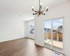 Dining Area w/ Patio Door to Rear Deck and view to Living Room