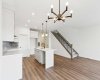 View from Dining Area to Kitchen & Stairs to Upper Floor