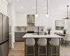 VIRTUALLY STAGED • Kitchen & Dining Area Beyond