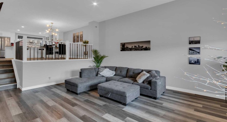Living room with vinyl flooring throughout main floor