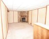 Great room is spacious with a wood burning fireplace