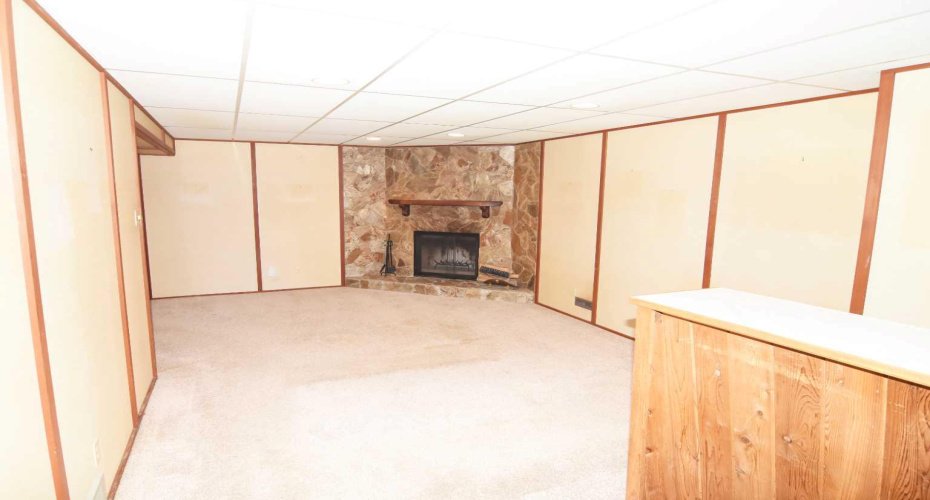 Great room is spacious with a wood burning fireplace