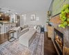 The fireplace creates a warm focal point while the open plan keeps everyone connected.